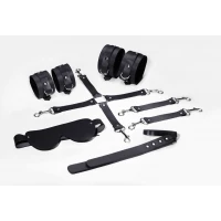 Набір Feral Feelings BDSM Kit 5 Black, наручники, поножі, хрестовина, маска, падл — Просмотреть изображение 1