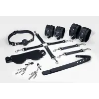 Набір Feral Feelings BDSM Kit 7 Black, наручники, поножі, конектор, маска, падл, кляп, затискачі — Просмотреть изображение 1